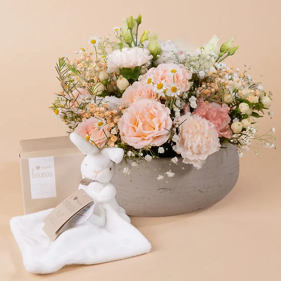 Douceur: white and pink round flower arrangement in a grey ceramic bowl with a white plush bunny